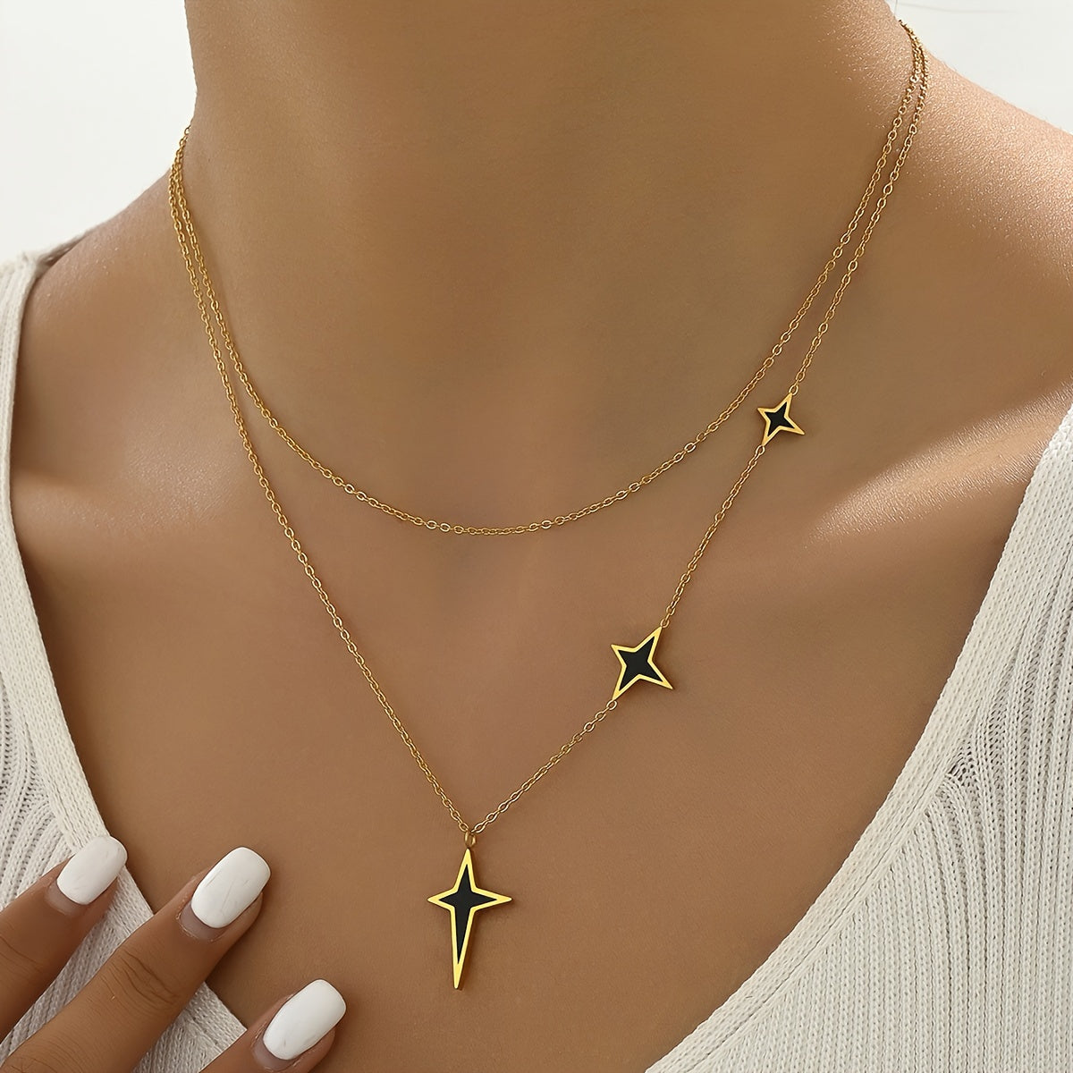 A stainless steel jewelry plated with real double layered black four-star necklace retro fashion personality design hip-hop trend sweet and cool Joker is suitable for ladies and lovers to wear at street daily commuting parties.